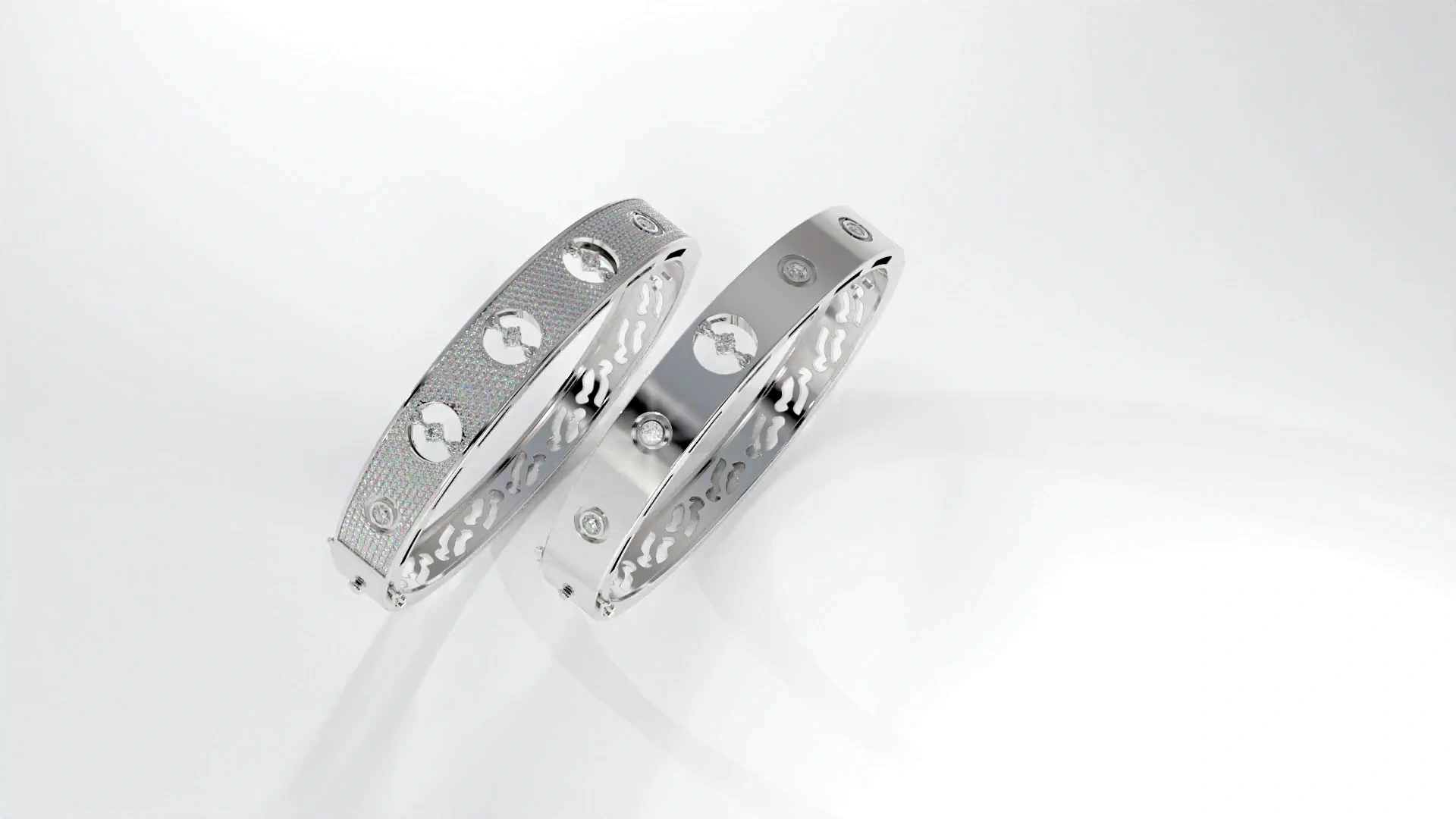 Still frame from a jewellery marketing animation: two channel-set bands on a studio gradient